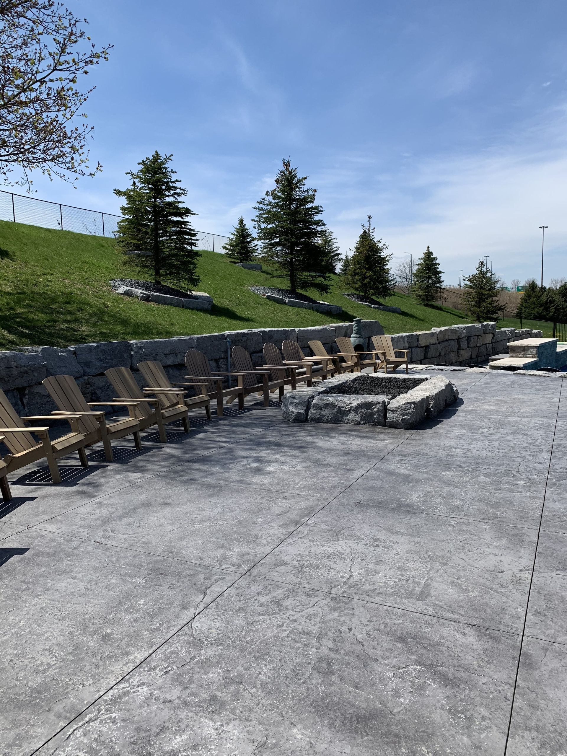 A wooden fence with a gate in front of a house.