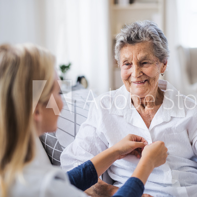 a woman assisting an elderly lady