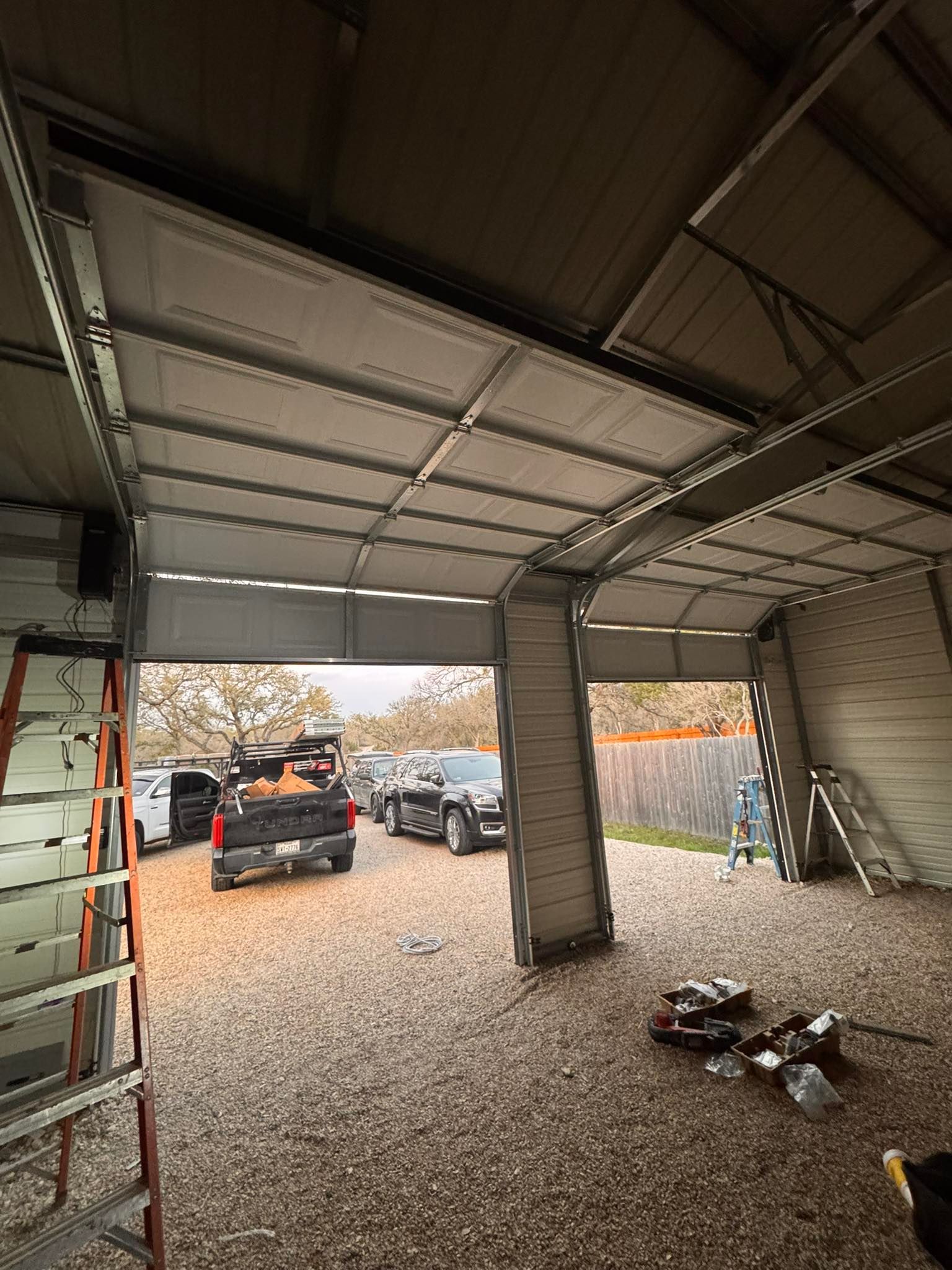outdoor storage building with two brand new garage doors installed