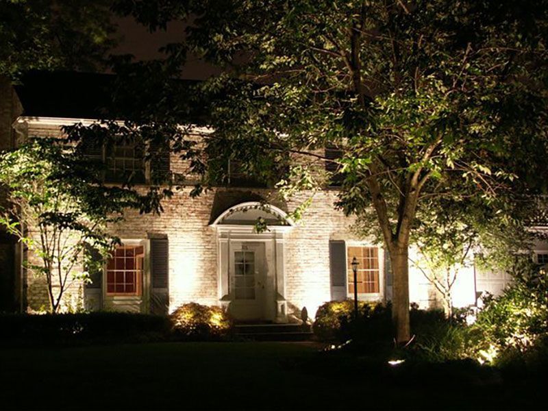 Exterior home spot lighting designed and installed by Chidsey Landscape & Design in Medina, Ohio