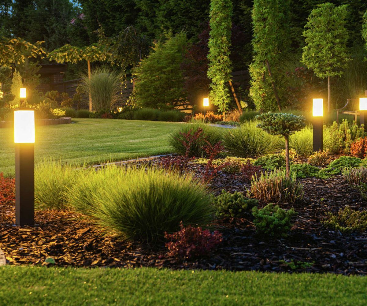 Outdoor path landscape lighting along Bath, OH garden bed.