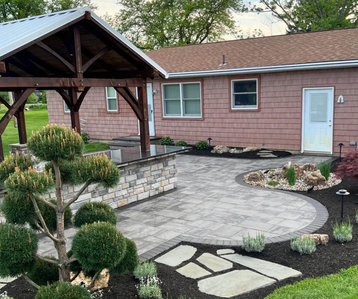Medina backyard patio with outdoor living design and installed by Chidsey Landscape and Design Northeast Ohio landscaper