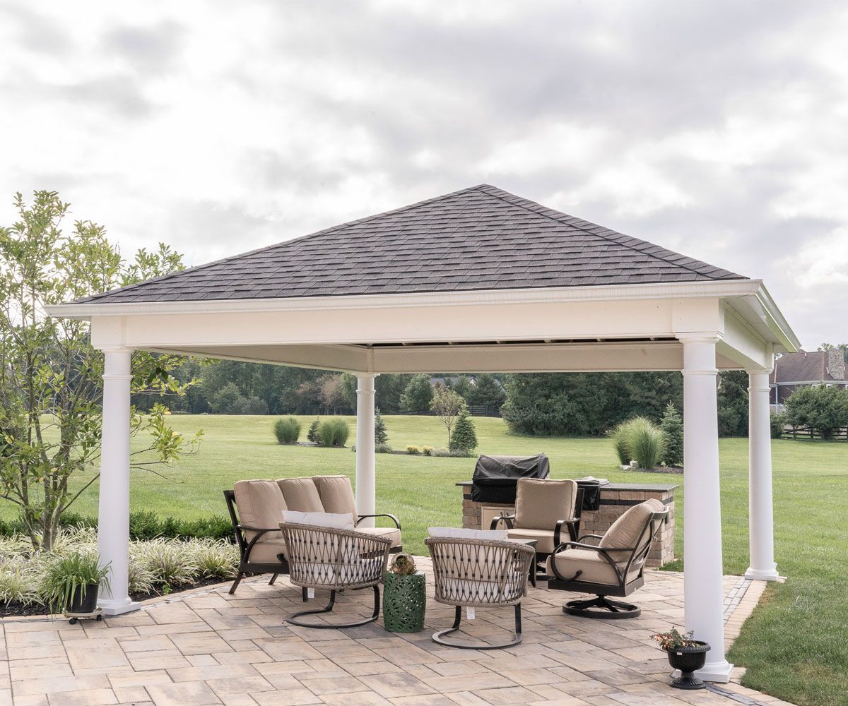 Amish-Crafted outdoor structure backyard pavilion on Bath, Ohio paver patio with outdoor furniture.