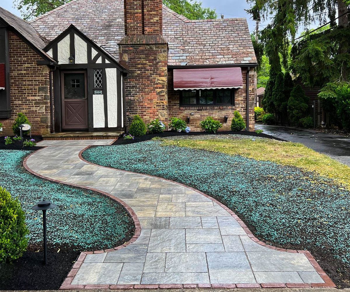 Paver stone front entrance path walkway to Brunswick, OH home designed and installed by Chidsey Landscape & Design