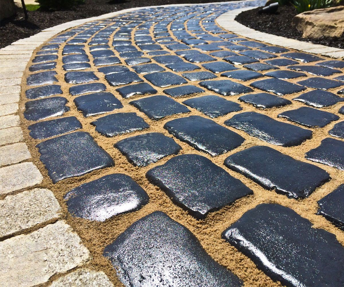 Cobbled paving stone front entrance walkway of Medina home designed and installed by Northeast Ohio landscaper Chidsey Landscape and Design
