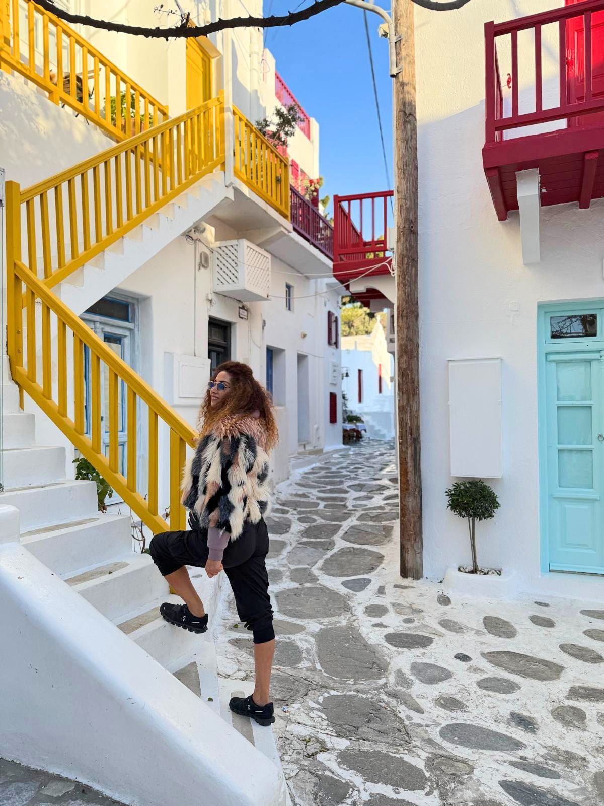 Tammy ascends stars as she explores a local, colourful Greek village