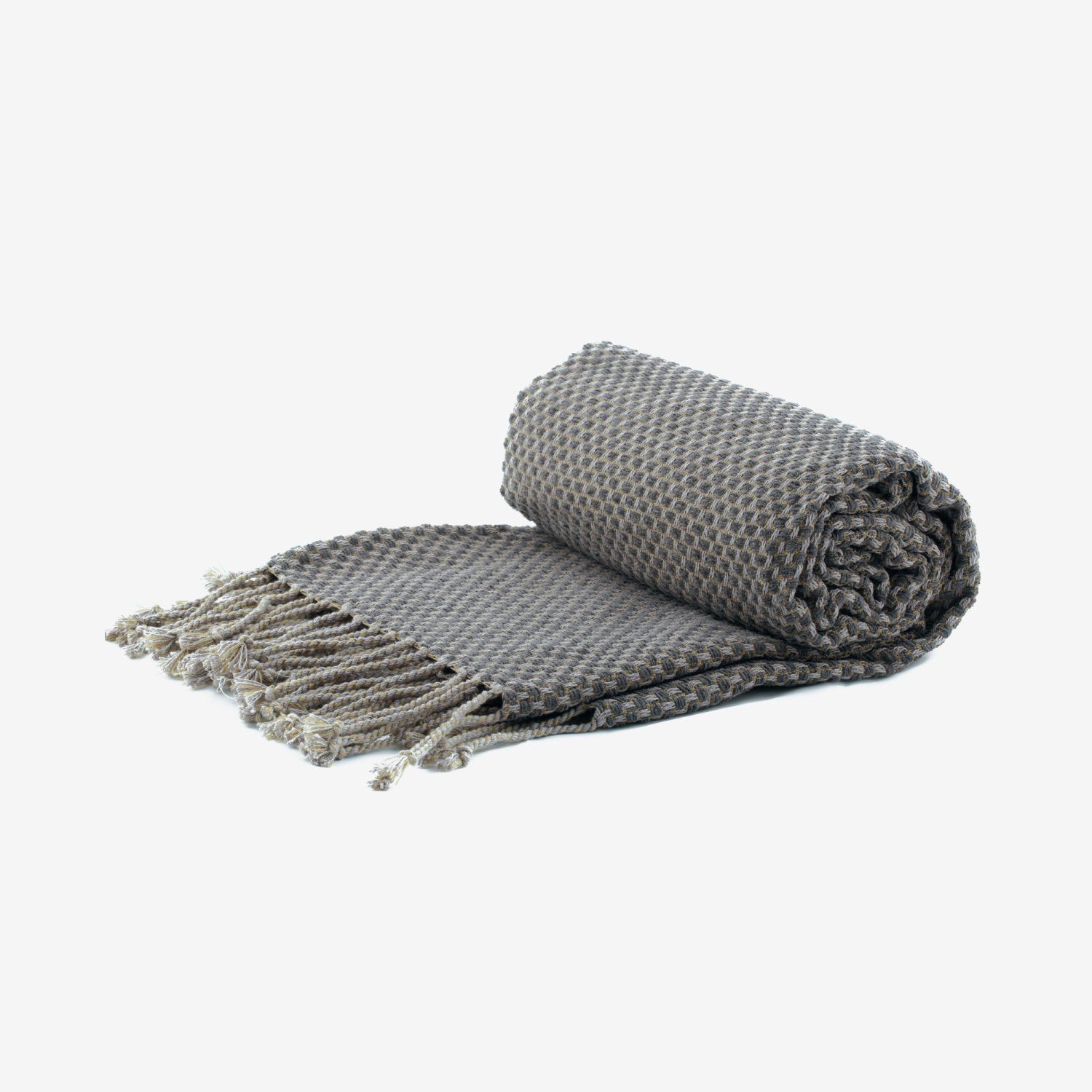 Gray knitted throw blanket, partially rolled, with fringe detail.