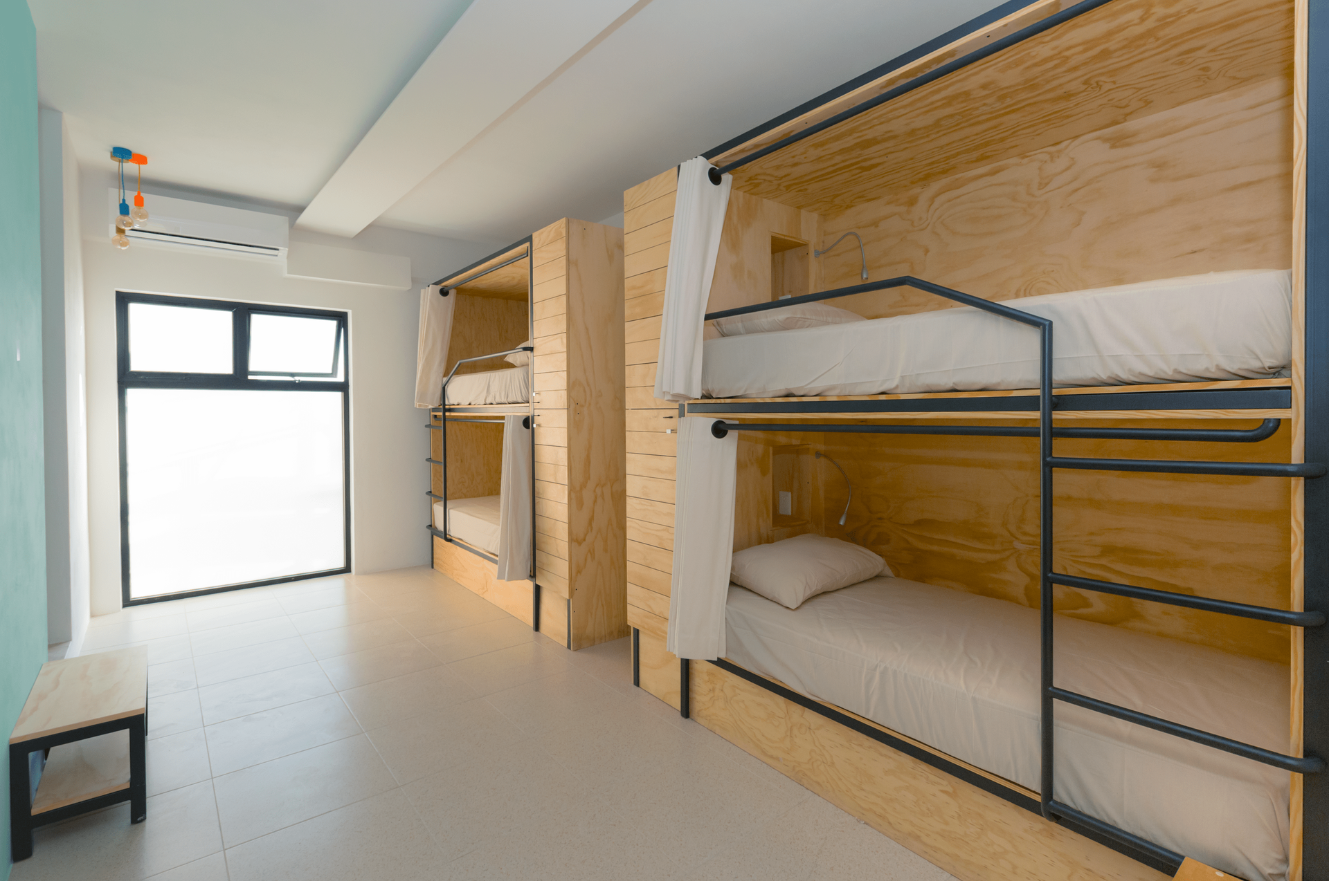 A room with a lot of bunk beds in it