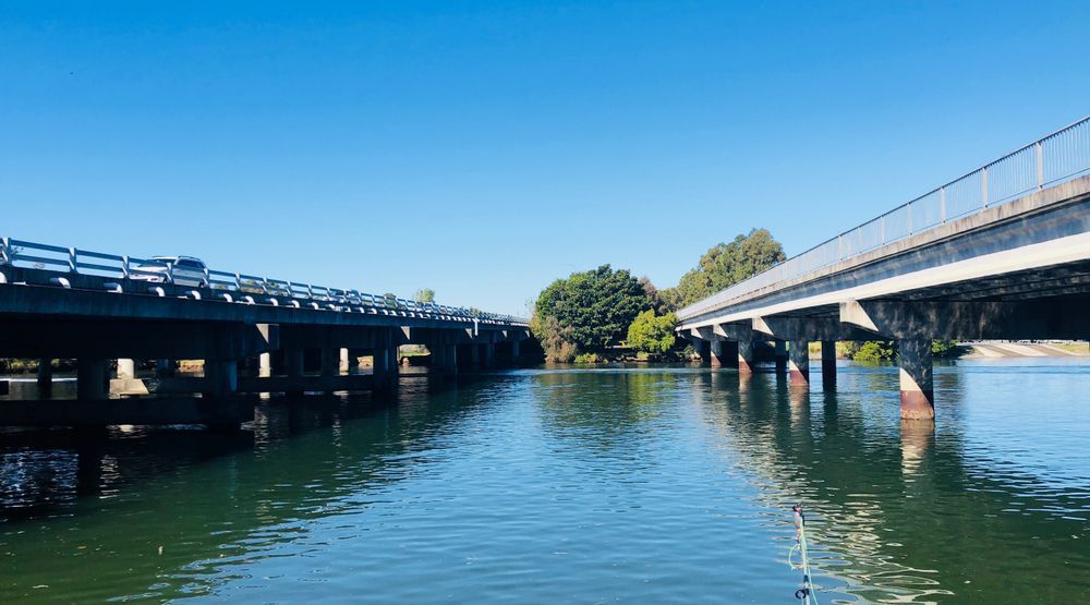 A Couple of Bridges Over a Body of Water in Coomera — Encore Carpet Professionals in Coomera, QLD