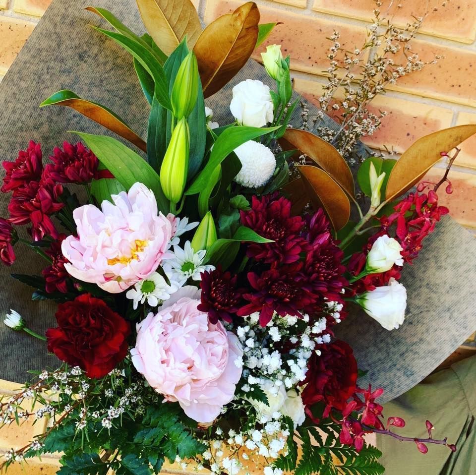 Bouquet of Pink and Burgundy Flowers Wrapped in Brown Paper — Denise's Flower Studio In Wellington, NSW