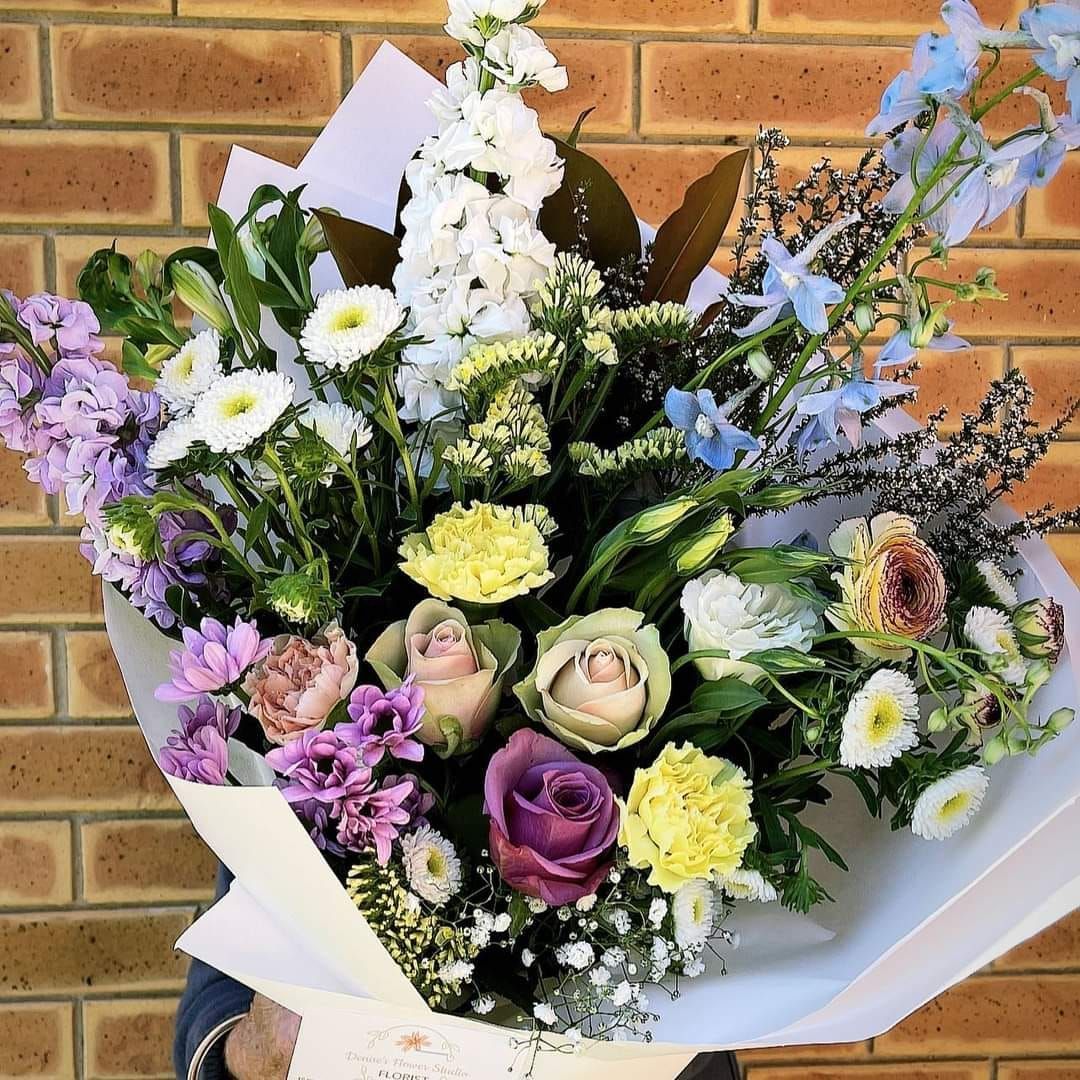 Bouquet of Colorful Flowers Wrapped in White Paper — Denise's Flower Studio In Walgett, NSW