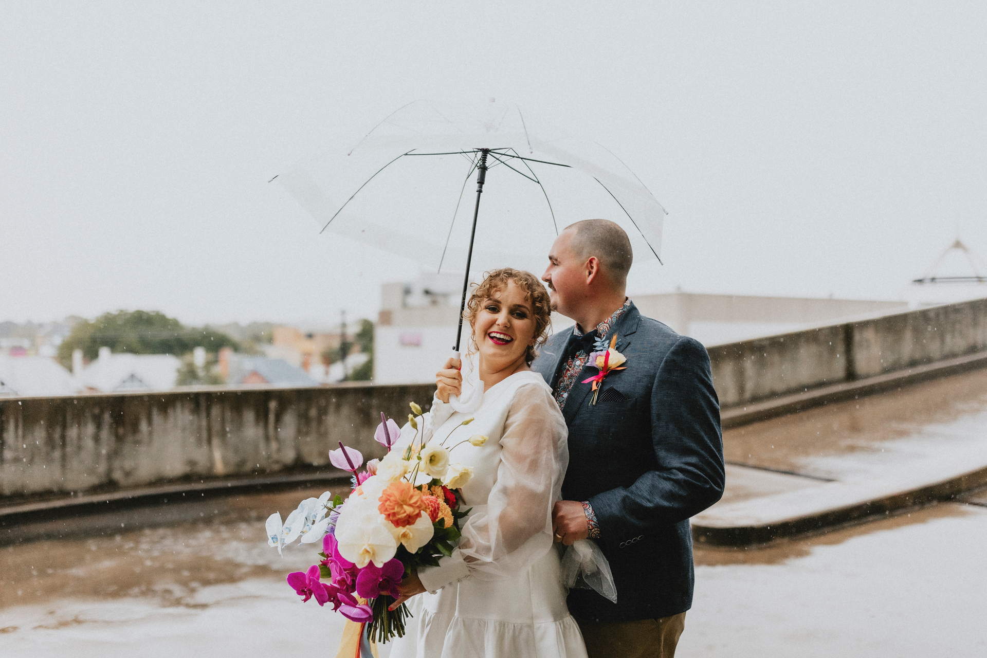 Bride and Groom with flowers and umbrella  — Florist in Dubbo, NSW