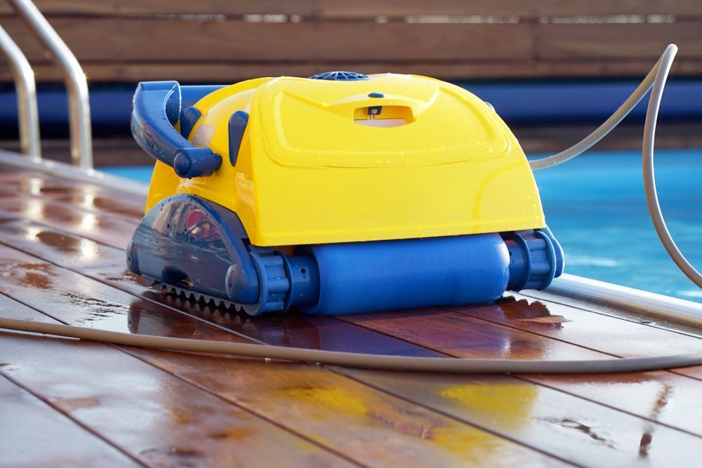 A Yellow and Blue Robotic Pool Cleaner — NQ Tropical Pools & Renovations in Cranbrook, QLD