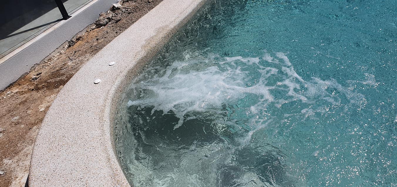 A Close Up of a Hot Tub in a Swimming Pool — NQ Tropical Pools & Renovations in Cranbrook, QLD