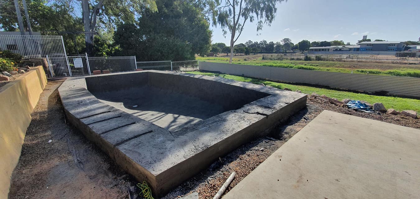 A Large Concrete Slab is Sitting in the Middle of a Field — NQ Tropical Pools & Renovations in Cranbrook, QLD