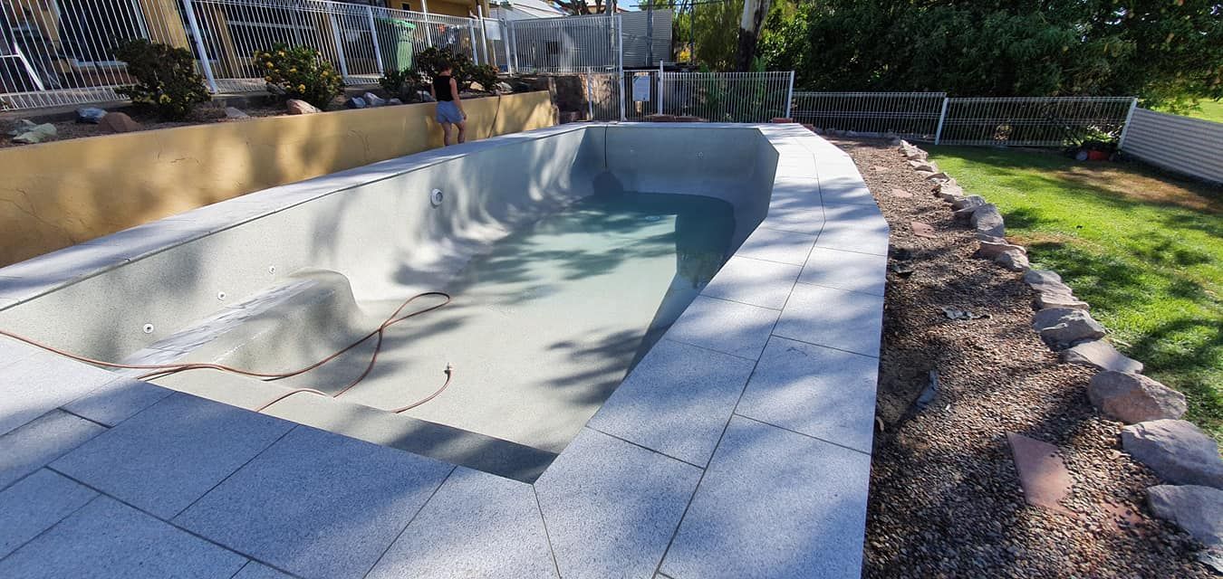 A Swimming Pool is Being Built in a Backyard — NQ Tropical Pools & Renovations in Bowen, QLD