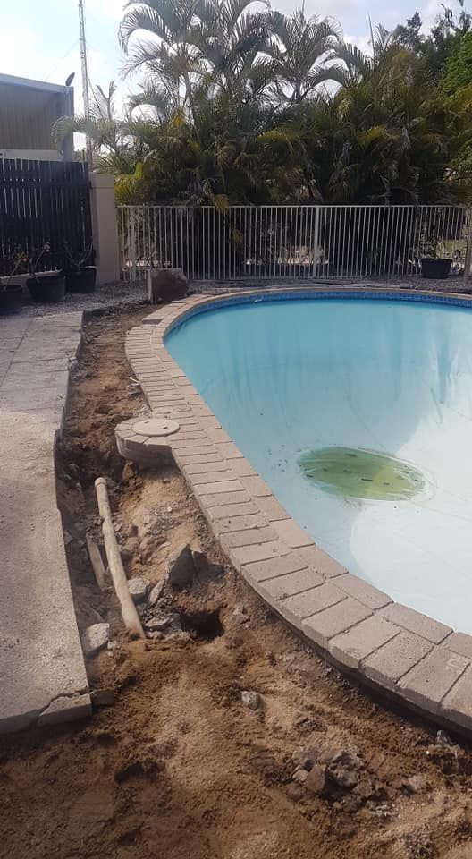 A Swimming Pool is Being Remodeled in a Backyard — NQ Tropical Pools & Renovations in Cranbrook, QLD