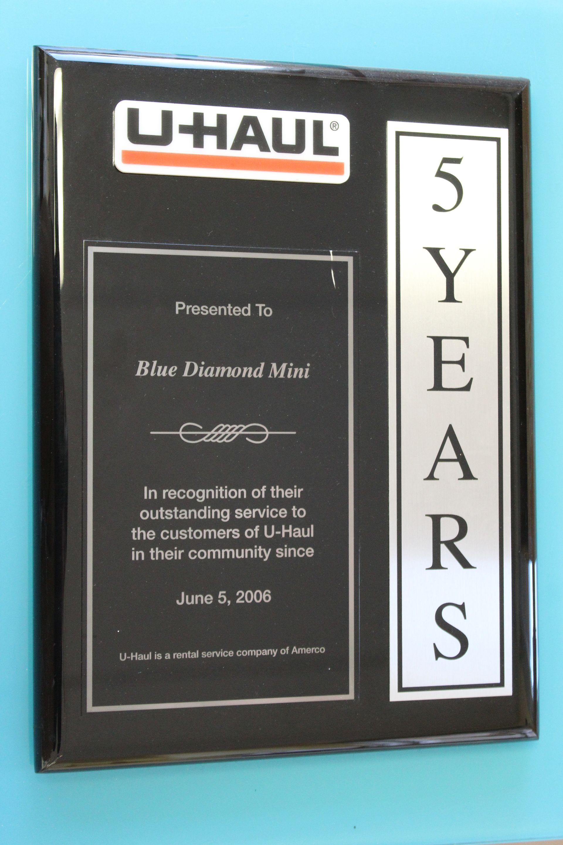 Plaque: U-Haul award for Blue Diamond Mini, 5 years of service. Black and silver design, June 5, 2006.