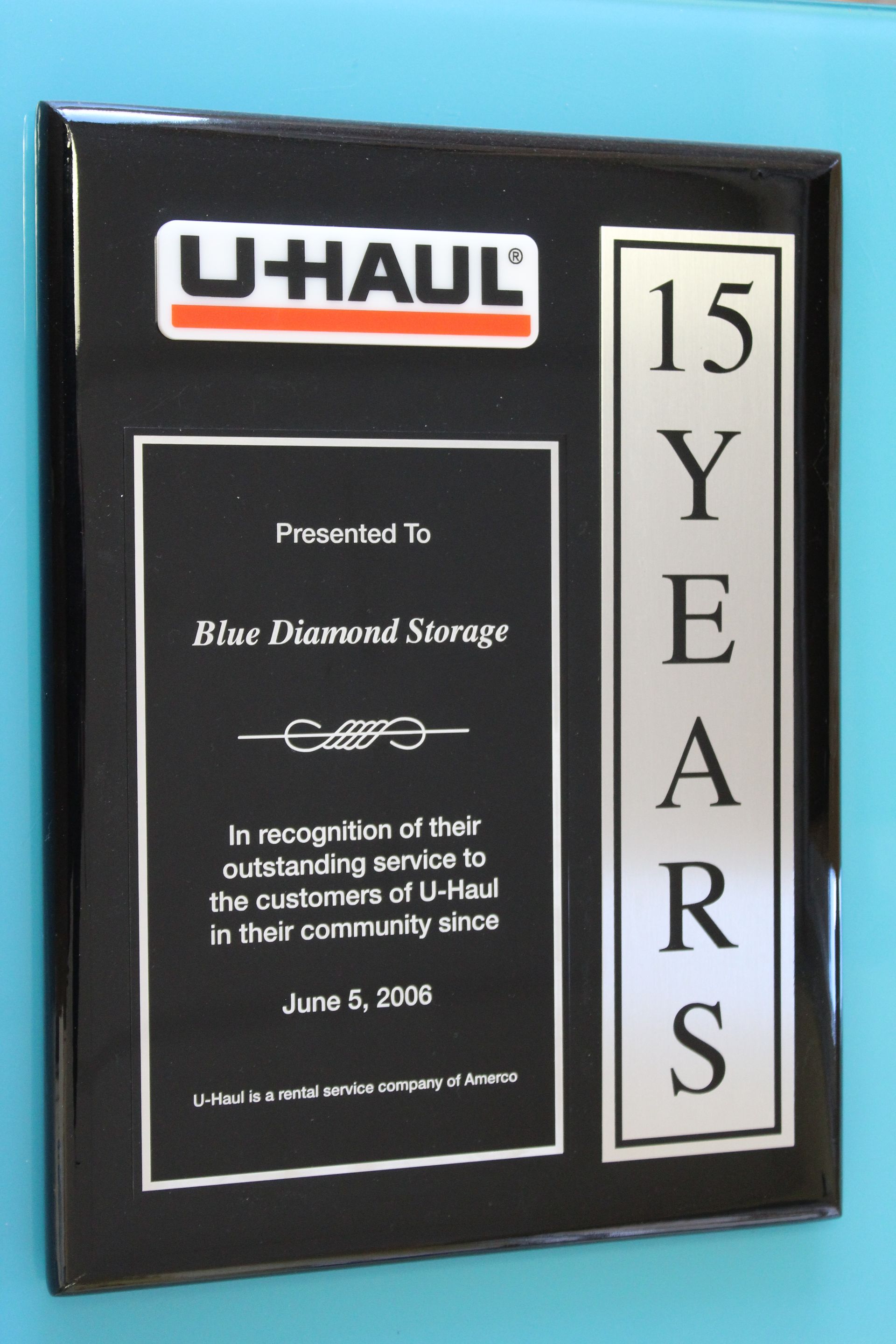 Black U-Haul plaque for Blue Diamond Storage, recognizing 15 years of service.