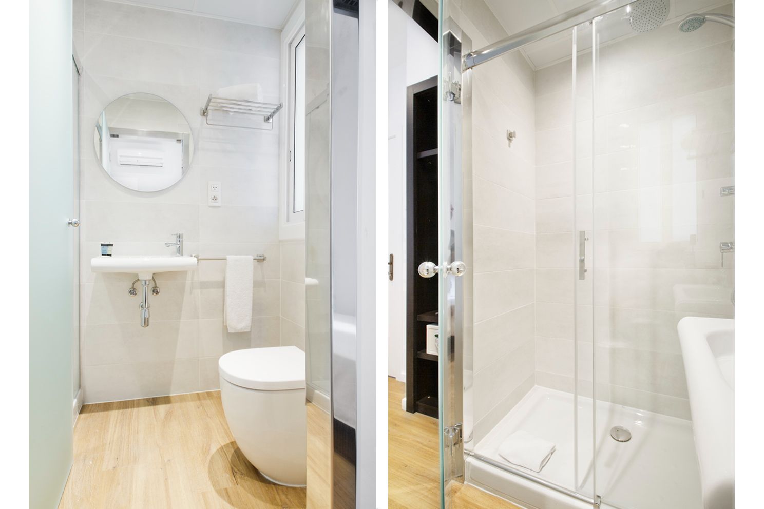 Vista de lado a lado de un baño moderno con lavabo blanco, inodoro y ducha con mampara de vidrio.