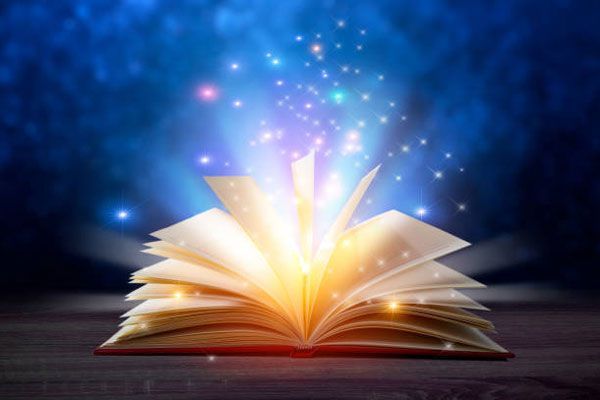 An open book with magical lights coming out of it.