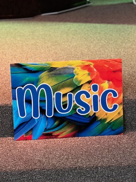 A colorful sign that says music on it