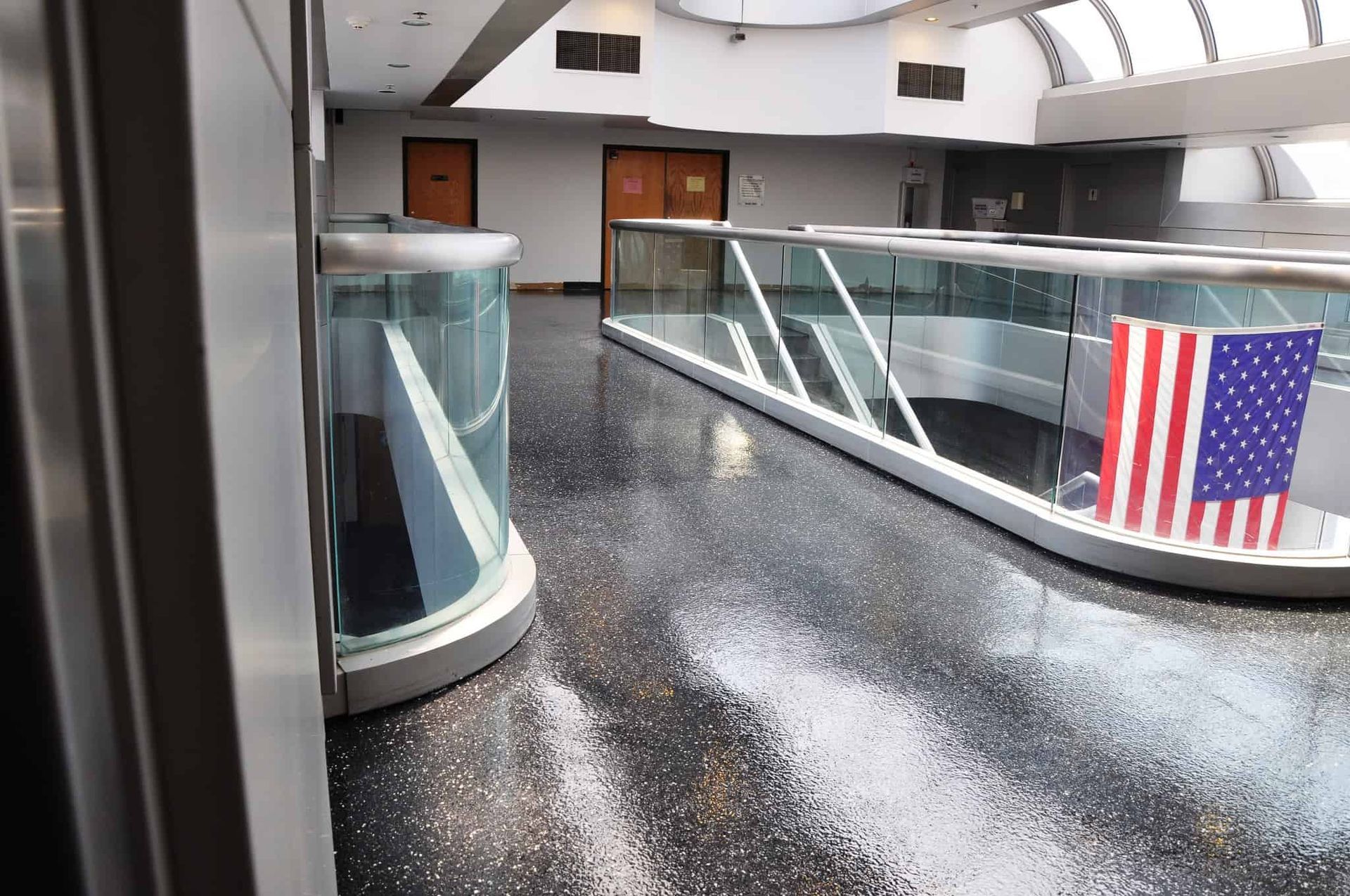 A hallway with an american flag on the floor