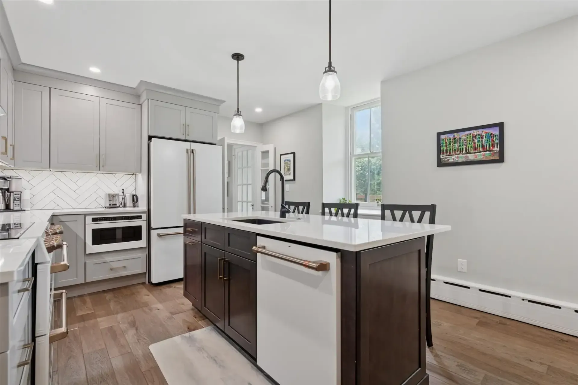 There is a large island in the middle of the kitchen.