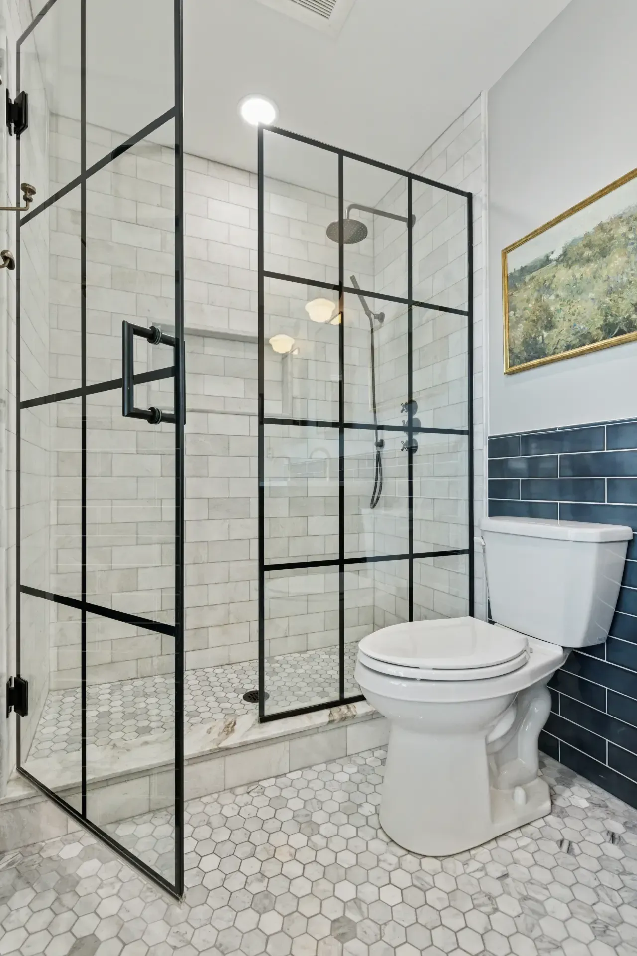 A bathroom with a walk in shower and a toilet.