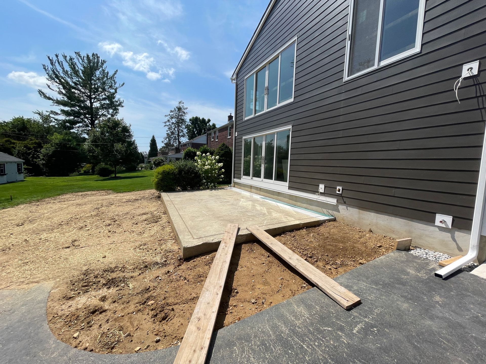 A home theater with a large couch and a large screen.