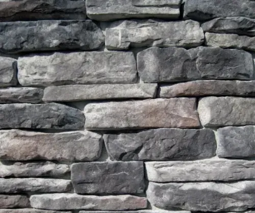 Hand writing in notebook with calculator and cash on a white table.