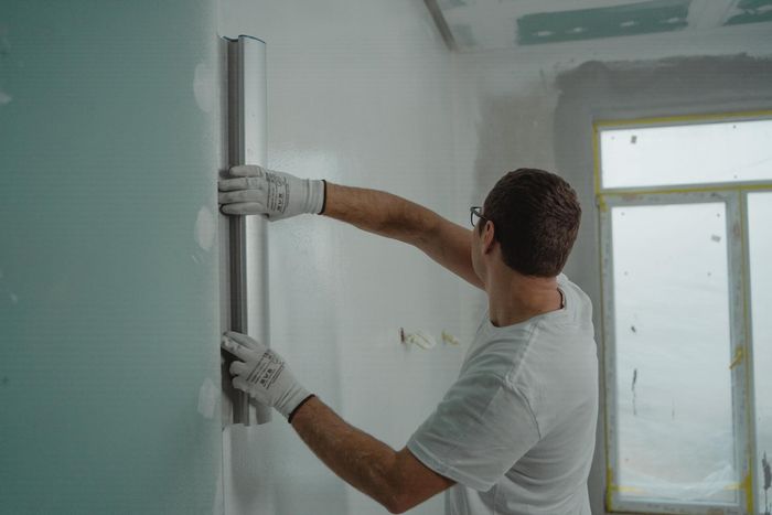 Professional interior painter in Hobart TAS painting an interior home property.