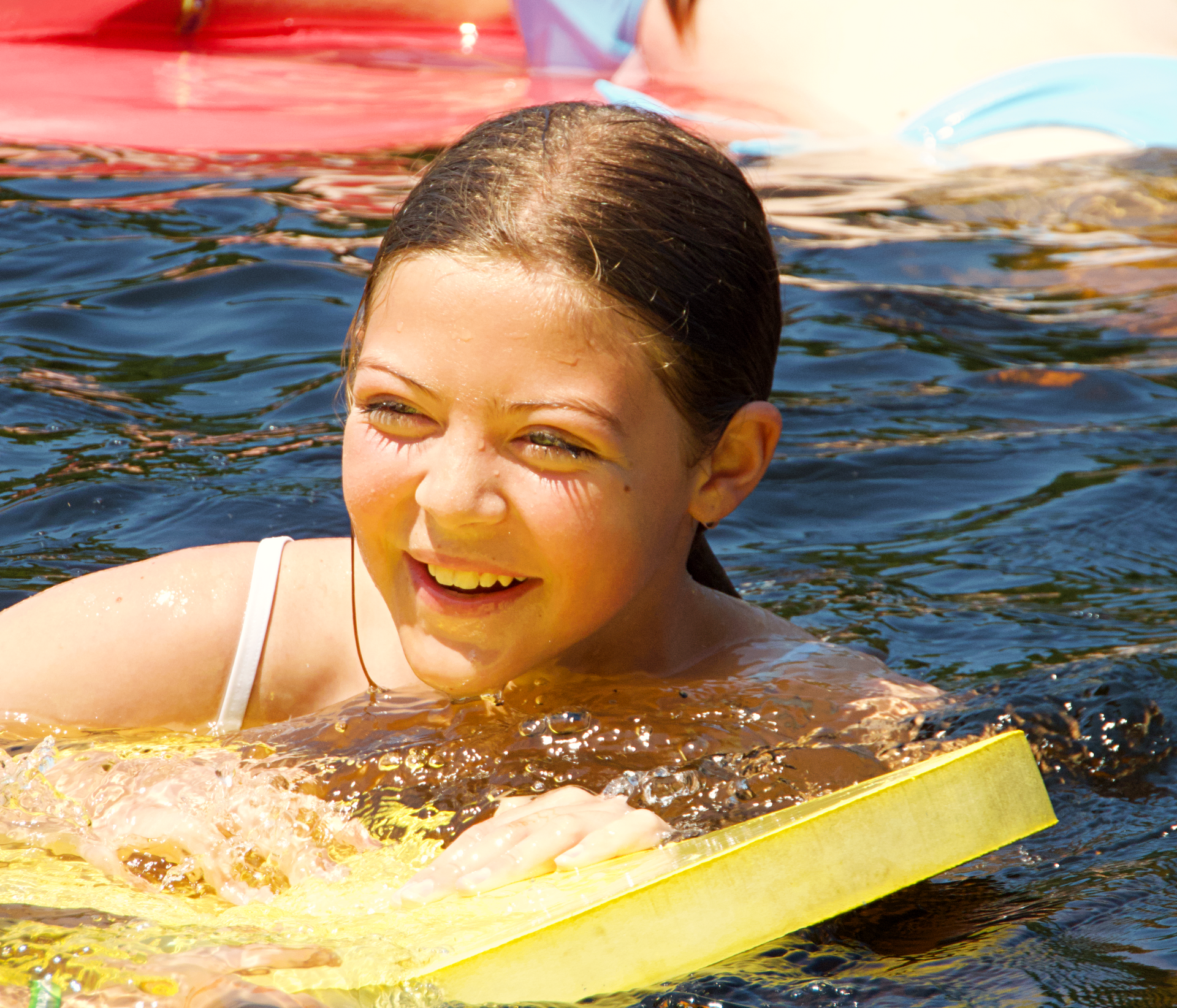 Smiling girl in the water
