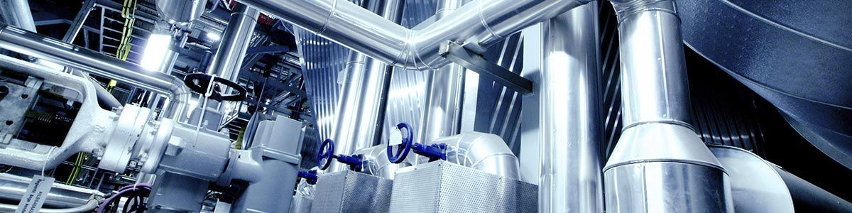 A Bunch Of Metal Pipes Are Hanging From The Ceiling — Dalrymple Sheet Metal In Mackay, QLD