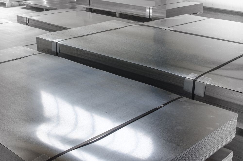 A Bunch Of Metal Sheets Are Stacked On Top — Dalrymple Sheet Metal In Garbutt, QLD
