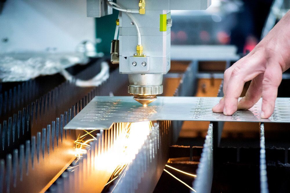 A Person Is Using A Laser Cutting Machine — Dalrymple Sheet Metal In Garbutt, QLD