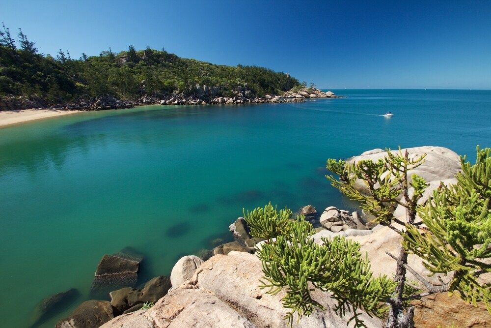 A Large Body Of Water Surrounded By Rocks And Trees — Dalrymple Sheet Metal In Mount Isa, QLD