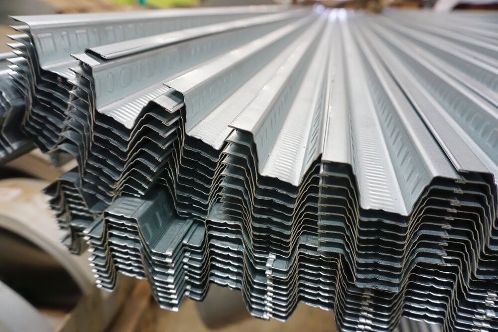 A Bunch Of Metal Sheets Are Stacked On Top — Dalrymple Sheet Metal In Garbutt, QLD