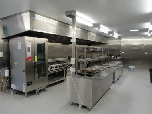 A Kitchen With A Lot Of Stainless Steel Appliances — Dalrymple Sheet Metal In Mount Isa, QLD