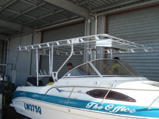 A Blue And White Boat With The Name The Office On It — Dalrymple Sheet Metal In Mackay, QLD