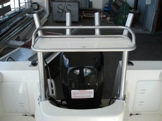 A Boat With A S/s Sign In The Background — Dalrymple Sheet Metal In Garbutt, QLD