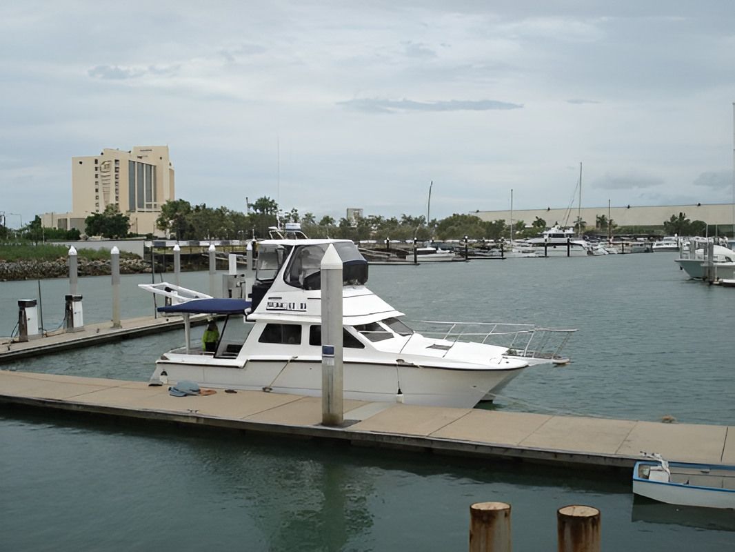 A Boat Is Docked At A Marina With The Name Aloha On The Side — Dalrymple Sheet Metal In Garbutt, QLD