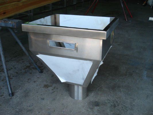 A Stainless Steel Container Is Sitting On A Concrete Floor — Dalrymple Sheet Metal In Garbutt, QLD