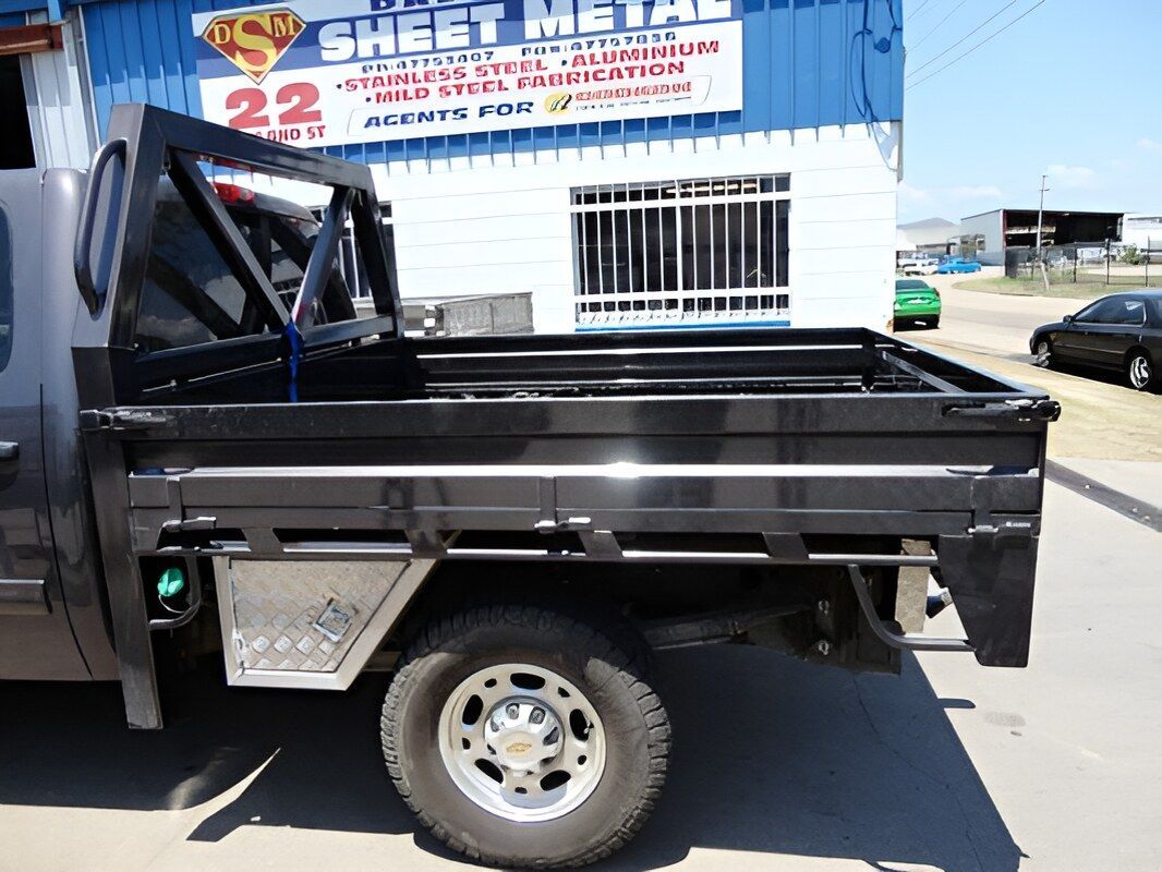 A Truck Is Parked In Front Of A Building That Says Sheet Metal — Dalrymple Sheet Metal In Garbutt, QLD