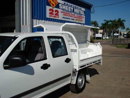 A White Truck Is Parked In Front Of A Building — Dalrymple Sheet Metal In Garbutt, QLD