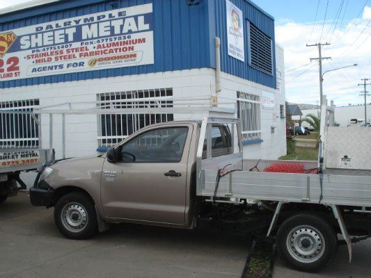 A Truck Is Parked In Front Of A Building That Says Sheet Metal — Dalrymple Sheet Metal In Mackay, QLD