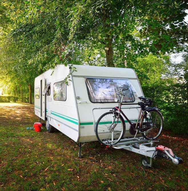 A Caravan With Two Bikes Attached to It — Chilltech Air Conditioning & Refrigeration In Central Highlands, QLD