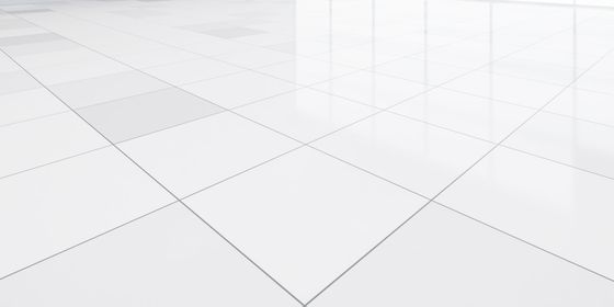 White tiled floor with dotted lines forming a grid pattern. Reflective surface.