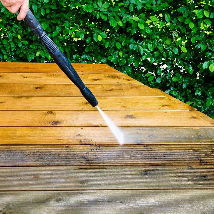 Cleaning Wooden Deck With A Pressure Cleaner — Pressure Washers In Bowen, QLD