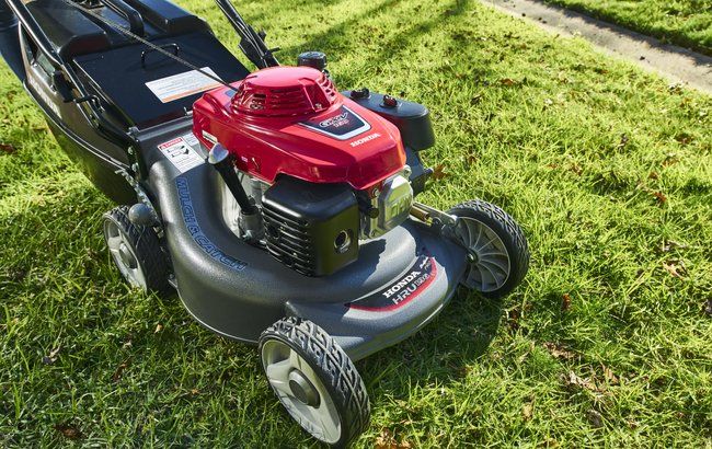 Green Push Lawnmower with Brushcutter — Lawn Mowers In Bowen QLD